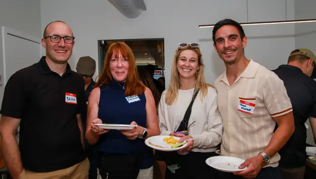 Guests enjoying refreshments at the Bloom Loft ribbon cutting