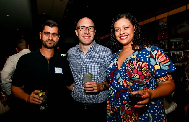 Guests with drinks at the Capital Grille mixer