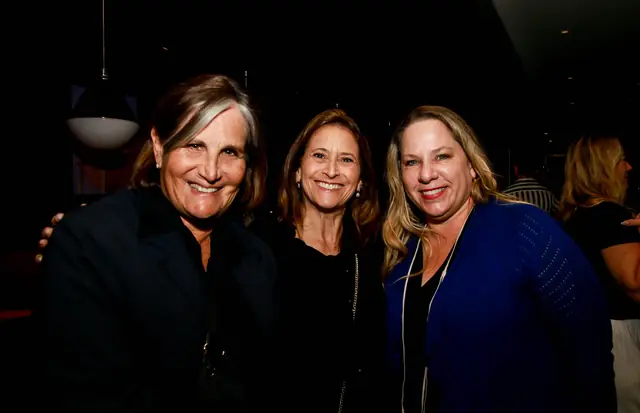 Members posing together at the Capital Grille mixer