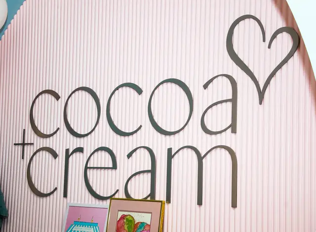 Cocoa & Cream logo wall inside the shop