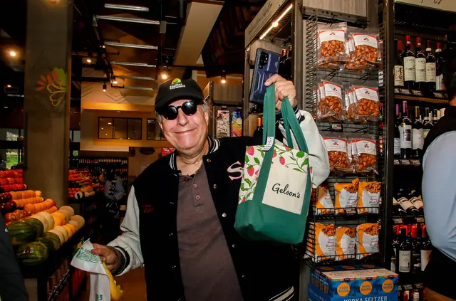 Shopper with a Gelson's tote inside the new Toluca Lake store