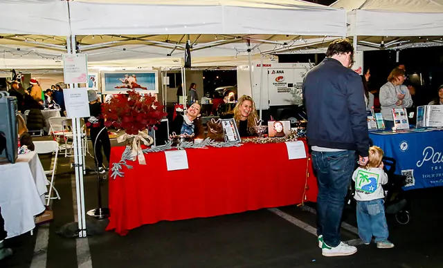 Vendor booths lining Riverside Drive for the holiday kickoff