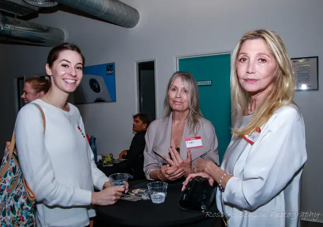 Three guests talking in the showroom
