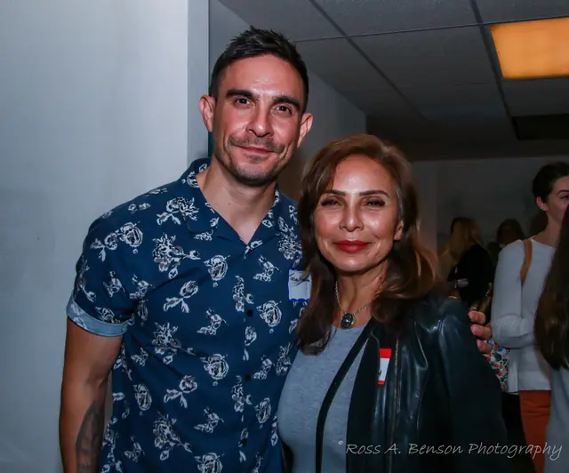 Two members posing together at the mixer