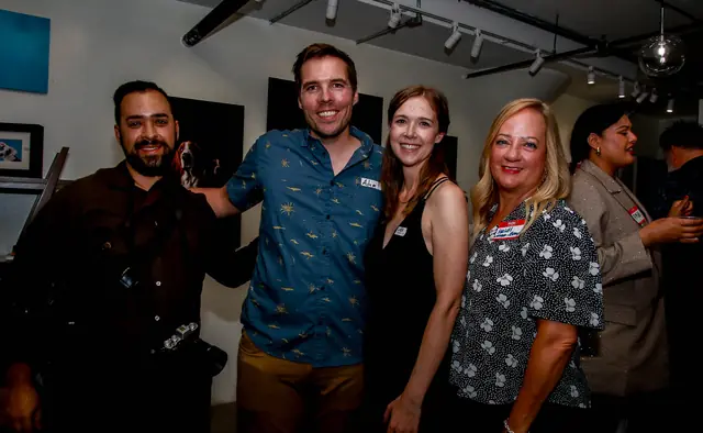 Guests celebrating at the Shuttermutt Photo ribbon cutting